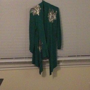 Long green cardigan with sequined snowflakes.